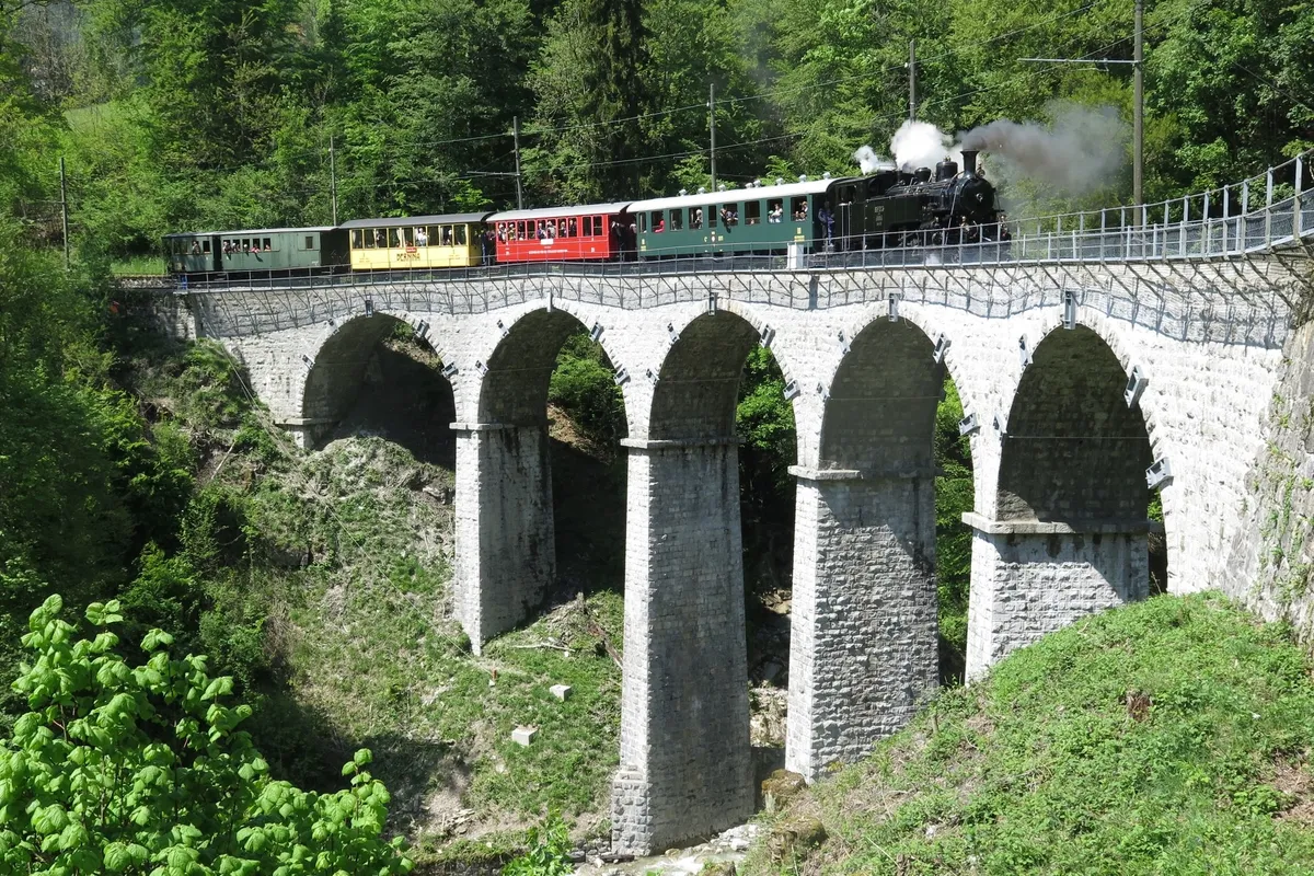 Historic Blonay-Chamby train crossing the Baye de Clarens viaduct